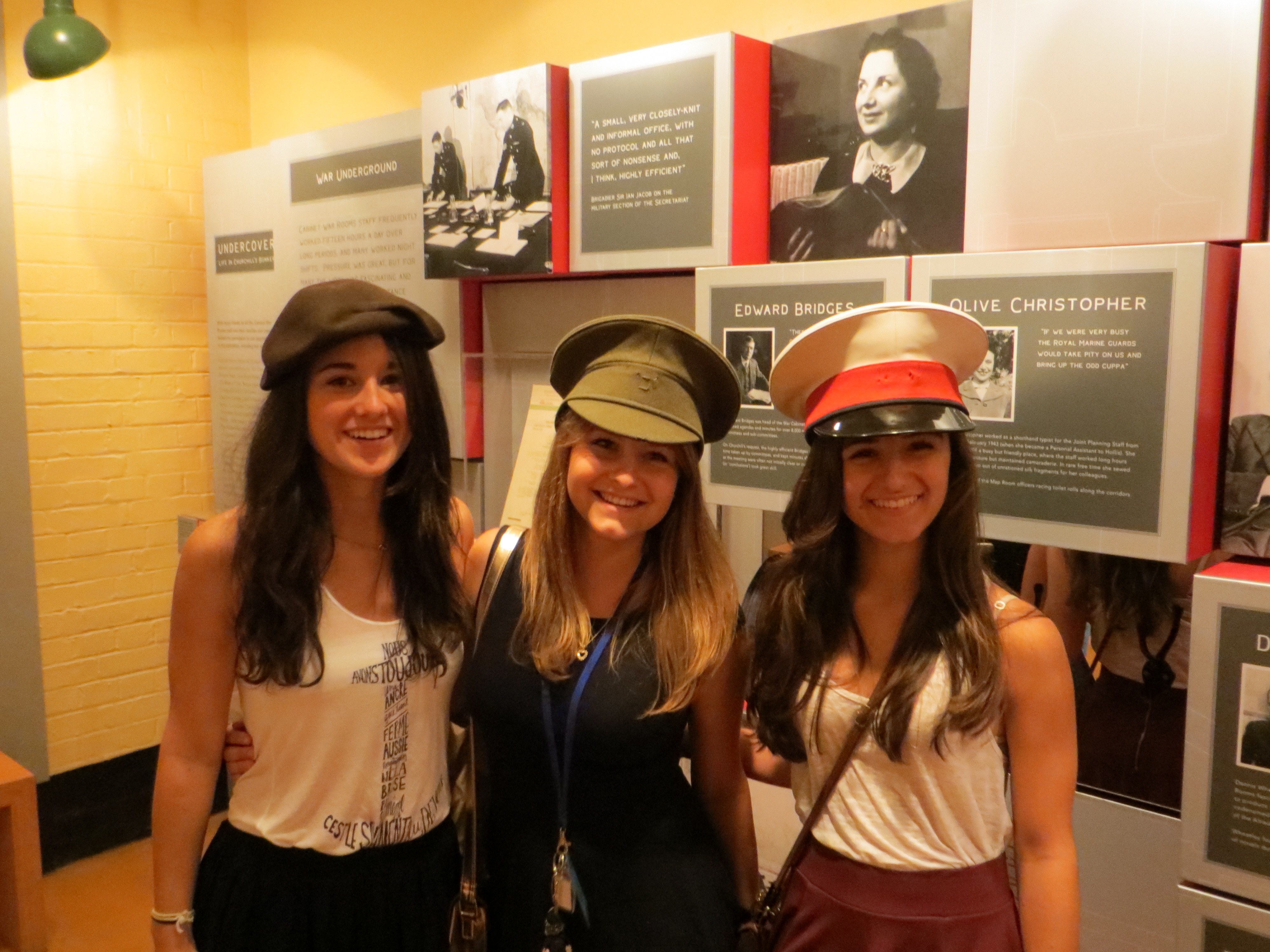 Students trying on military hats in the War Rooms!